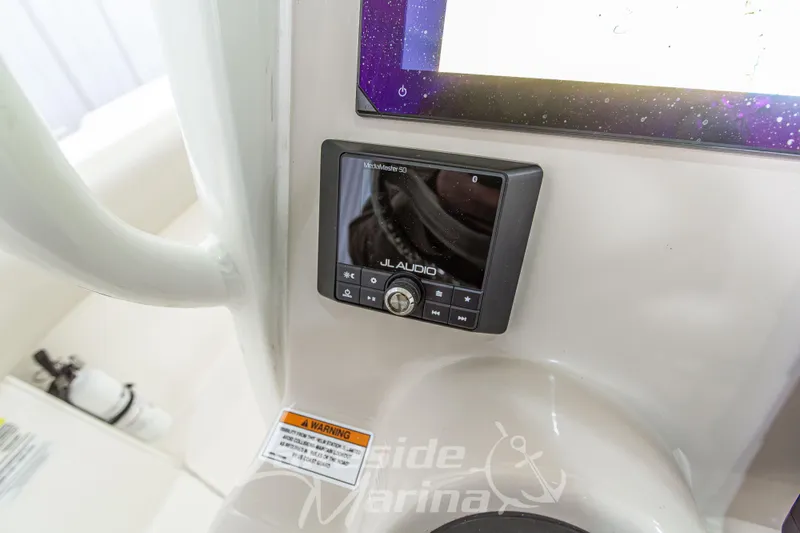 Slide: The Image of Control panel of 2023 Boston Whaler 250 Outrage with JL Audio system. - 37