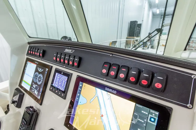 Slide: The Image of Dashboard of 2023 Boston Whaler 250 Outrage with Simrad navigation system. - 41