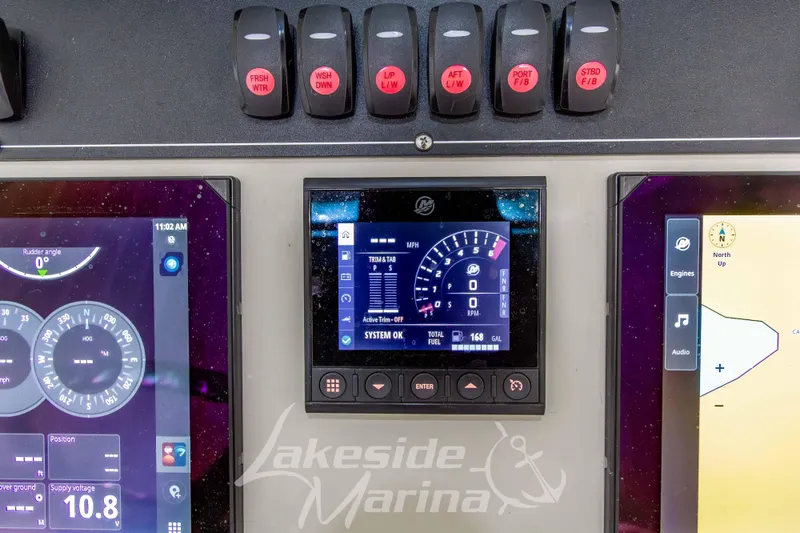 Slide: The Image of Dashboard of 2023 Boston Whaler 250 Outrage with navigation and control displays. - 42