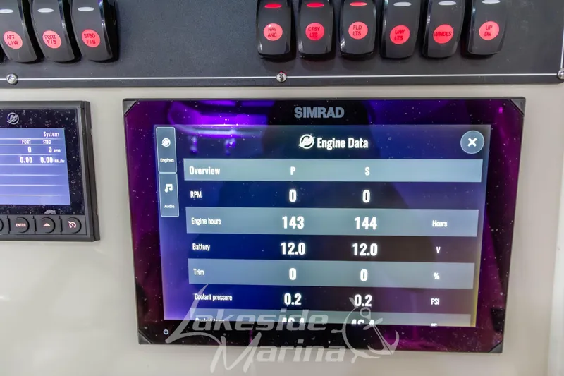 Slide: The Image of 2023 Boston Whaler 250 Outrage dashboard displaying engine data on Simrad screen. - 43