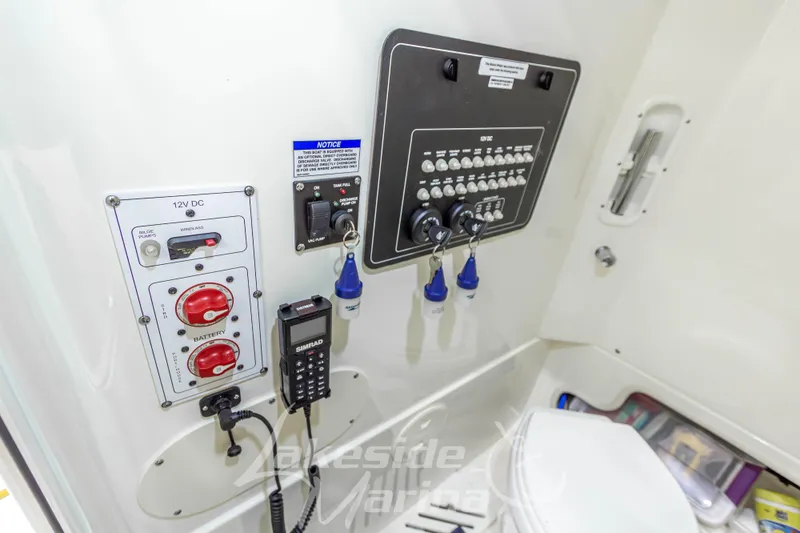 Slide: The Image of Control panel of a 2023 Boston Whaler 250 Outrage boat interior. - 48
