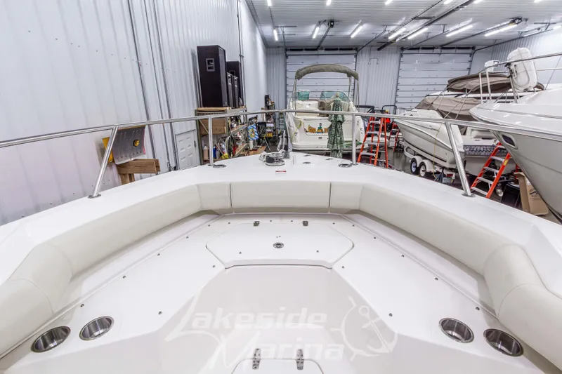 Slide: The Image of 2023 Boston Whaler 250 Outrage boat interior in a marina storage facility. - 56