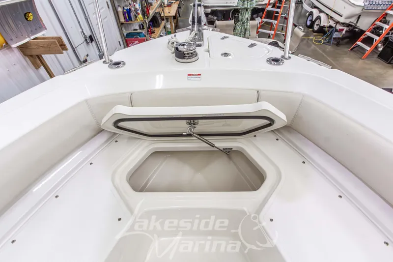 Slide: The Image of 2023 Boston Whaler 250 Outrage boat interior with open storage compartment at Lakeside Marina. - 57