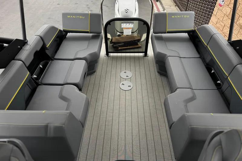 Slide: The Image of Interior view of 2025 Manitou EXPLORE 24 pontoon boat with spacious seating. - 14