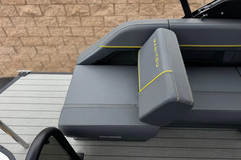 Slide: The Image of 2025 Manitou EXPLORE 24 boat seat with gray upholstery and yellow accents. - 20