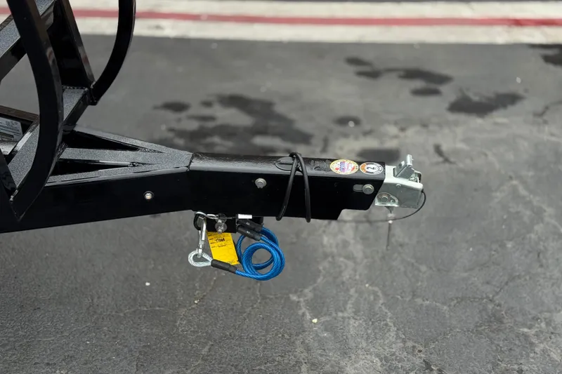 Slide: The Image of Trailer hitch of 2025 Manitou EXPLORE 24 on asphalt surface. - 28