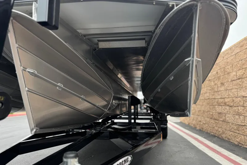 Slide: The Image of Underneath view of 2025 Manitou EXPLORE 24 pontoon boat on trailer. - 4