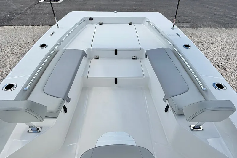 Slide: The Image of Bay Rider 2260 FS Skiff 2027 interior with cushioned seating and rod holders. - 11