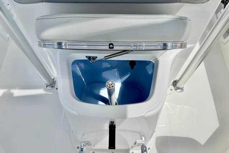 Slide: The Image of Livewell compartment in a 2027 Bay Rider 2260 FS Skiff boat, featuring a blue interior. - 17
