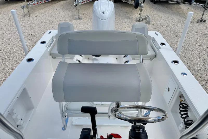 Slide: The Image of Bay Rider 2260 FS Skiff 2027 boat interior with dual seating and steering wheel. - 20
