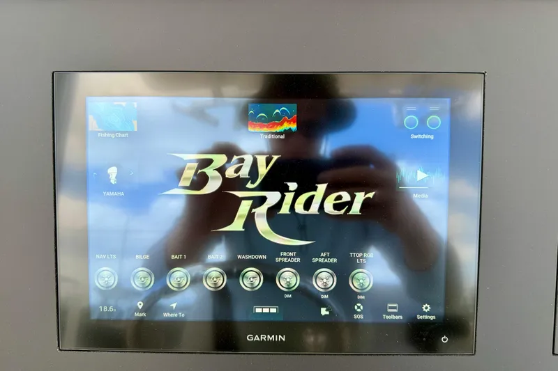 Slide: The Image of Touchscreen display of a 2027 Bay Rider 2260 FS Skiff with navigation and control features. - 24