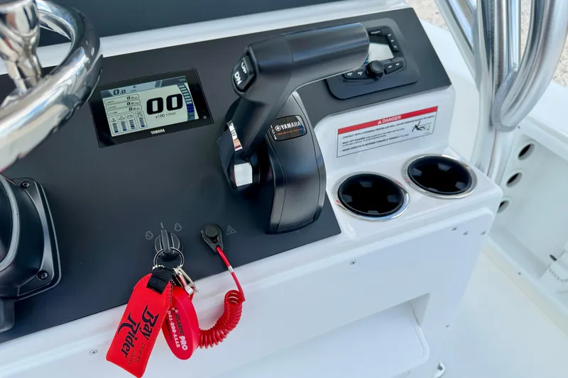 Slide: The Image of Control panel of 2027 Bay Rider 2260 FS Skiff with Yamaha throttle and display. - 25