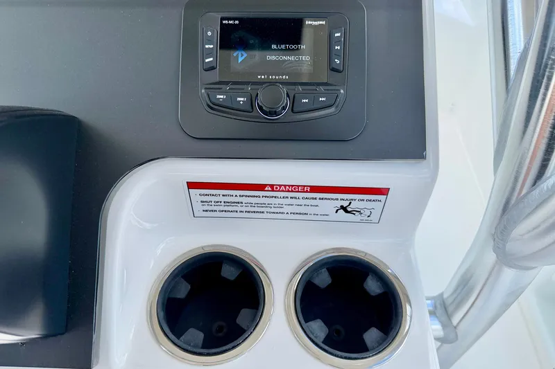 Slide: The Image of Bay Rider 2260 FS Skiff 2027 console with Bluetooth stereo and cup holders. - 26