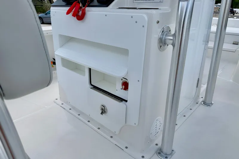 Slide: The Image of Bay Rider 2260 FS Skiff 2027 console with storage compartments and safety equipment. - 28