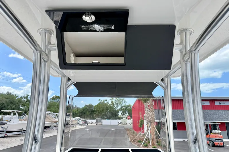 Slide: The Image of Bay Rider 2260 FS Skiff 2027 model with open storage compartment, showcasing sleek design. - 29
