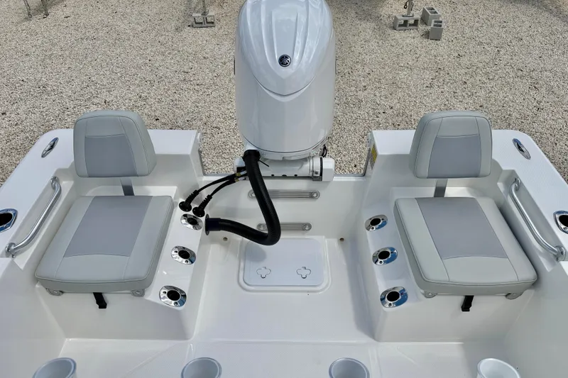 Slide: The Image of 2027 Bay Rider 2260 FS Skiff boat interior with dual seats and motor. - 31