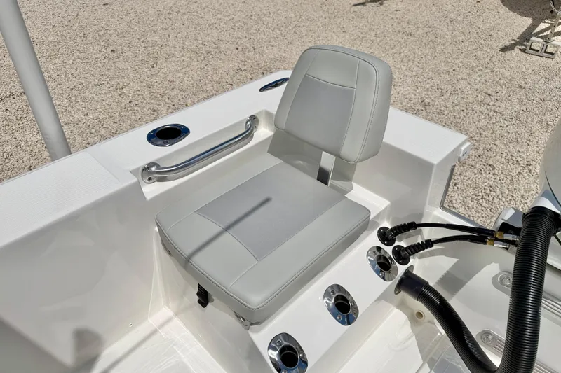 Slide: The Image of Bay Rider 2260 FS Skiff 2027 boat seat with cup holders and control panel. - 32