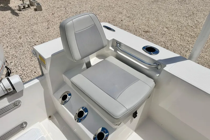 Slide: The Image of Bay Rider 2260 FS Skiff 2027 boat seat with cup holders and grab rail. - 33