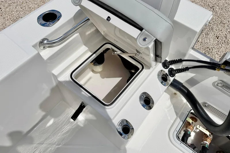 Slide: The Image of Bay Rider 2260 FS Skiff 2027 boat interior with open storage compartment and fittings. - 35