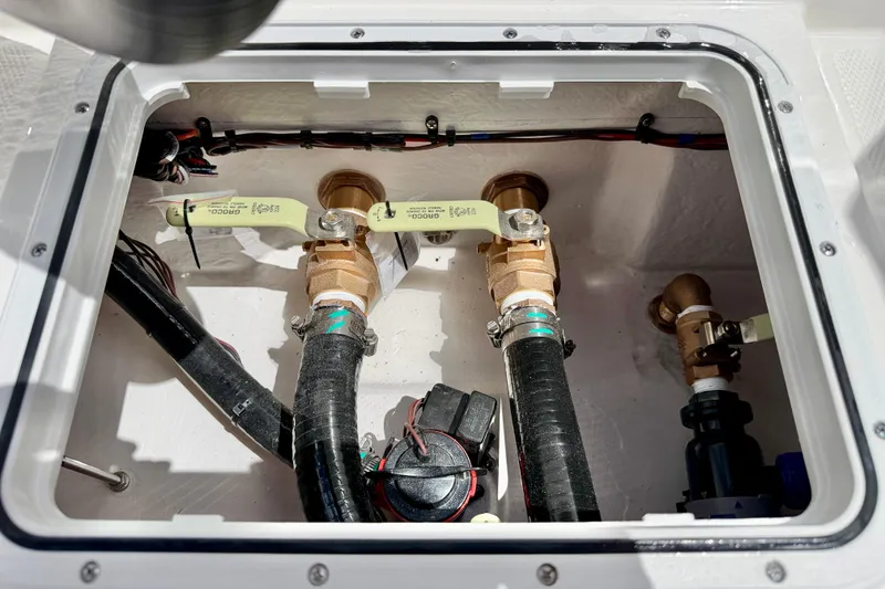 Slide: The Image of Bay Rider 2260 FS Skiff 2027 boat plumbing system with valves and hoses. - 37