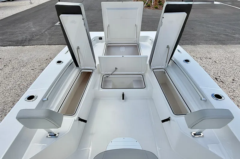Slide: The Image of Bay Rider 2260 FS Skiff 2027 boat interior with open storage compartments. - 38