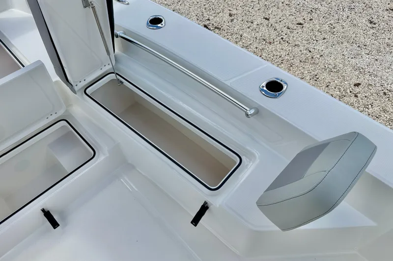 Slide: The Image of Interior view of 2027 Bay Rider 2260 FS Skiff, showcasing storage compartments and seating. - 39