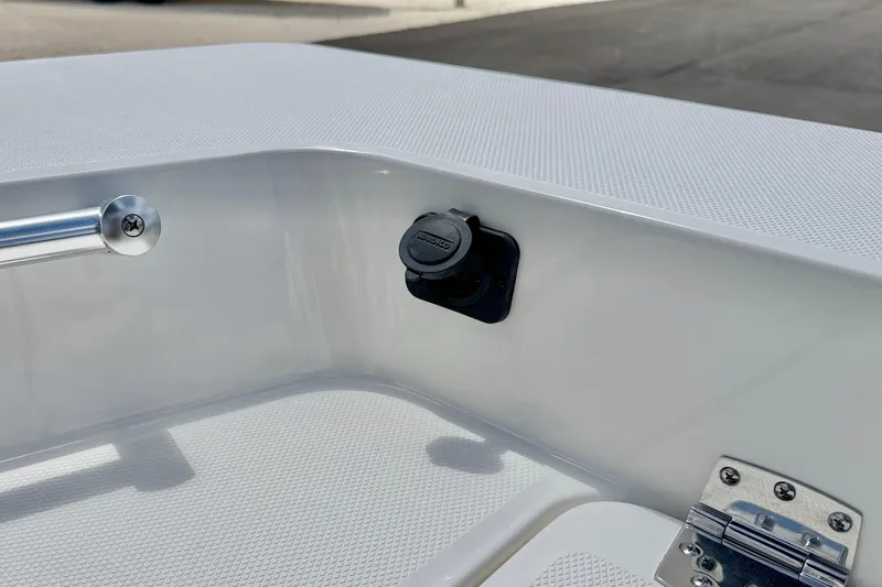 Slide: The Image of 2027 Bay Rider 2260 FS Skiff interior detail with power outlet and stainless steel hardware. - 44