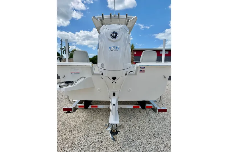 Slide: The Image of Bay Rider 2260 FS Skiff 2027 with powerful outboard motor on a trailer. - 51