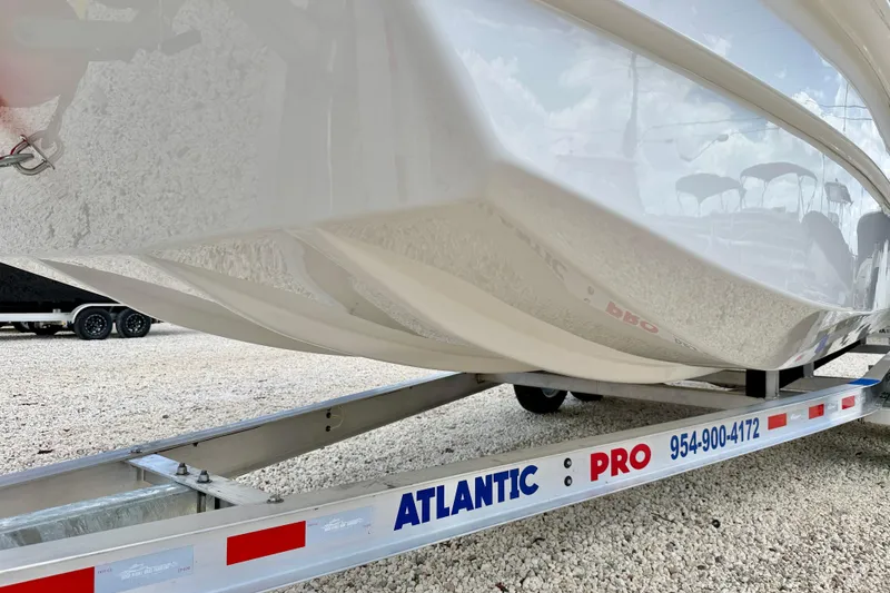 Slide: The Image of Bay Rider 2260 FS Skiff 2027 on Atlantic Pro trailer, showcasing sleek hull design. - 55