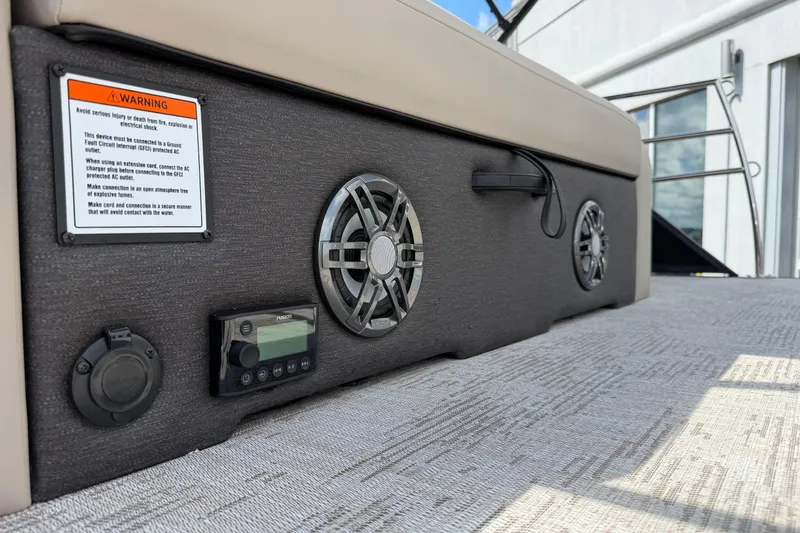 Slide: The Image of 2026 Crest Conquest 230 SLSC boat interior with speakers and control panel. - 14