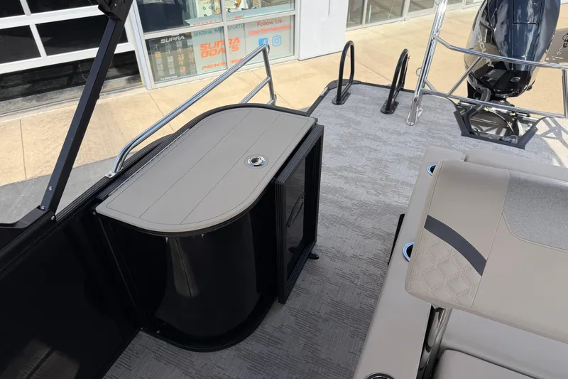 Slide: The Image of 2026 Crest Conquest 230 SLSC boat interior with seating and storage area. - 15