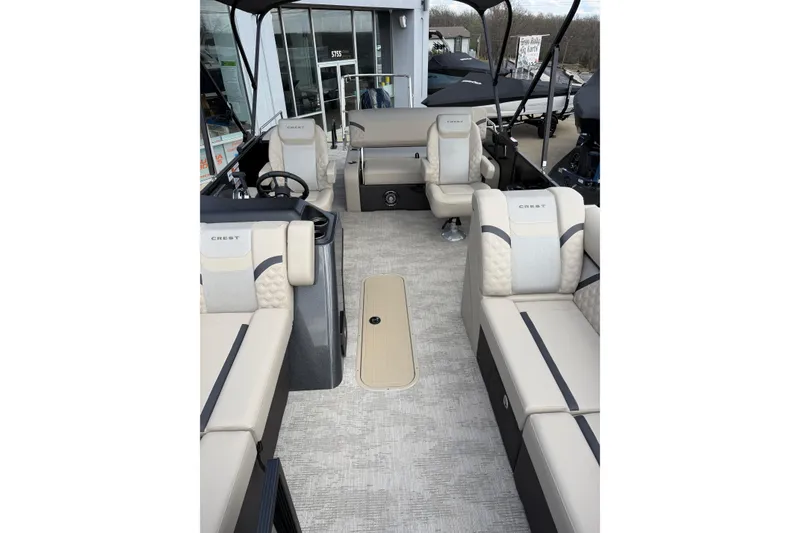 Slide: The Image of 2026 Crest Conquest 230 SLSC boat interior with luxurious seating and modern design. - 18
