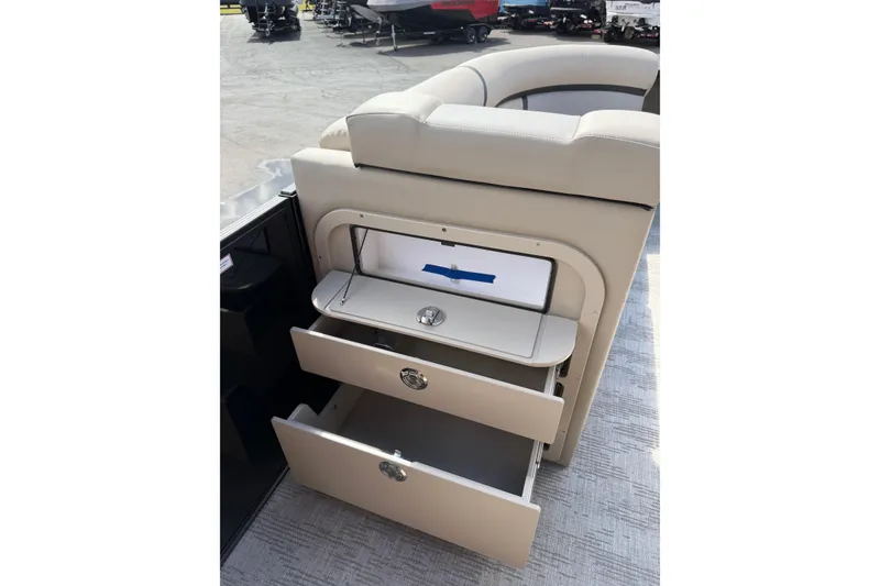 Slide: The Image of 2026 Crest Conquest 230 SLSC boat interior with open storage compartments. - 26