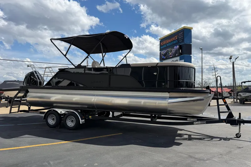 Slide: The Image of 2026 Crest Conquest 230 SLSC pontoon boat on trailer under cloudy sky. - 8