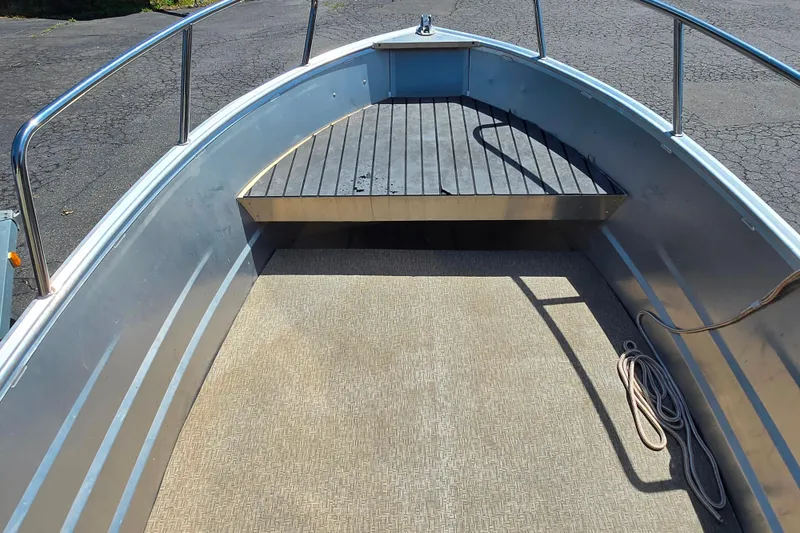 Slide: The Image of 2023 Marlon MV 16 boat interior with metal railings and textured flooring. - 5