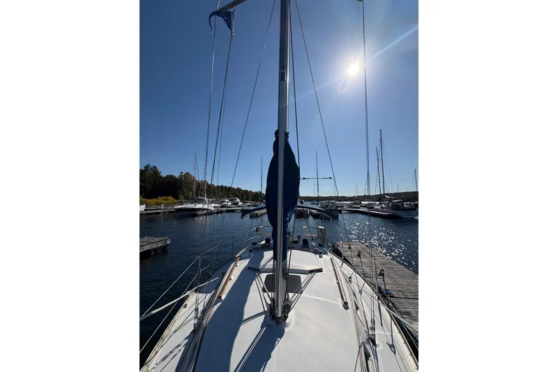 Slide: The Image of Sailboat docked in marina under clear sky, Hunter 28, 1993 model. - 13