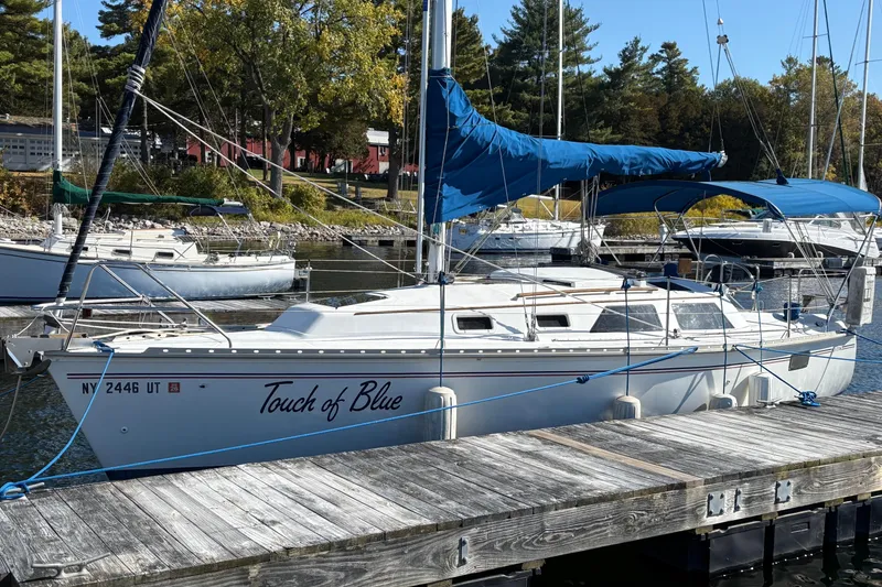 Slide: The Image of Sailboat "Touch of Blue" docked, 1993 Hunter 28 model, with blue sail cover. - 3