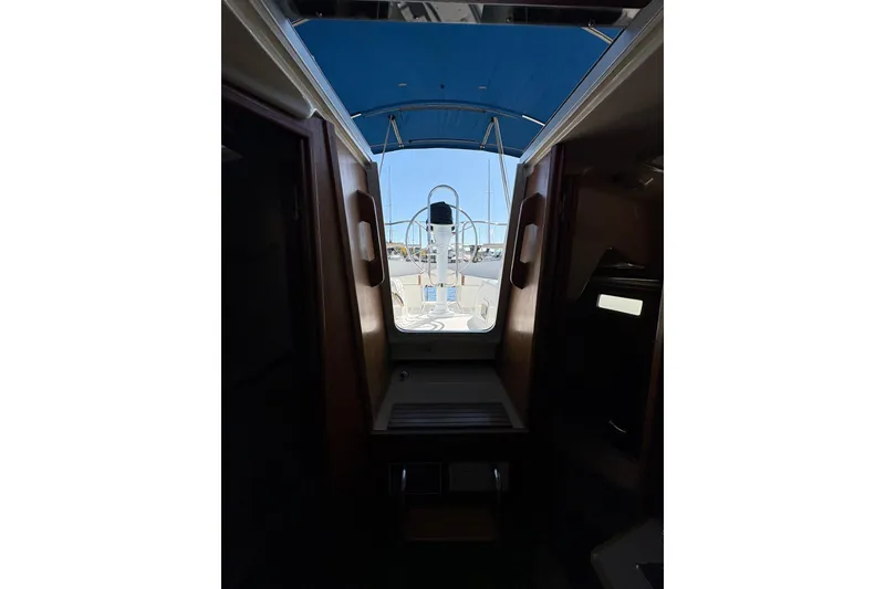 Slide: The Image of Interior view of a 1993 Hunter 28 sailboat, showcasing the cabin entrance and deck. - 60