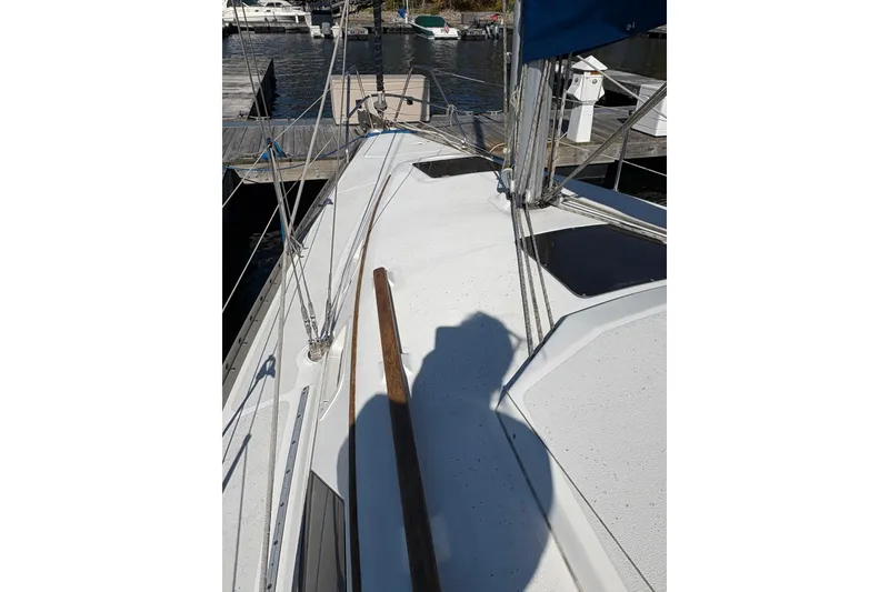 Slide: The Image of 1993 Hunter 28 sailboat deck with rigging at marina. - 9