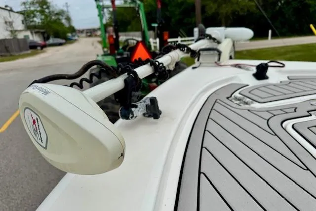 Slide: The Image of 2020 Sea Pro 248 Bay boat with trolling motor on deck, parked on street. - 18