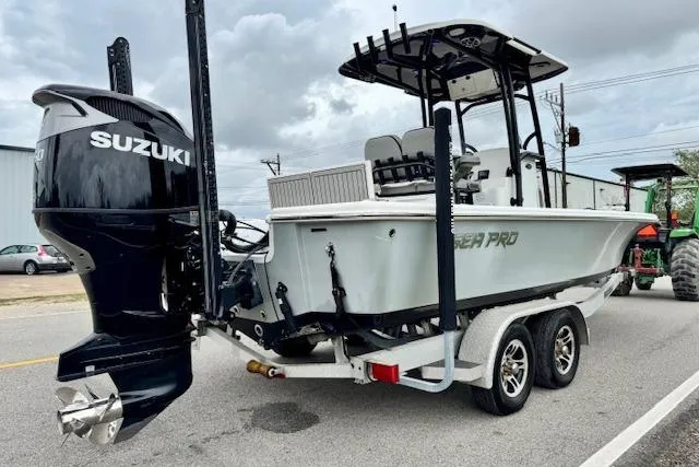 Slide: The Image of 2020 Sea Pro 248 Bay boat on trailer with Suzuki outboard motor. - 4