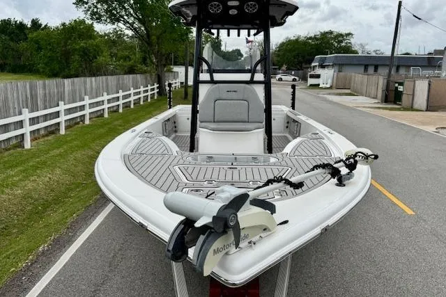 Slide: The Image of 2020 Sea Pro 248 Bay boat on road, featuring sleek design and advanced trolling motor. - 6