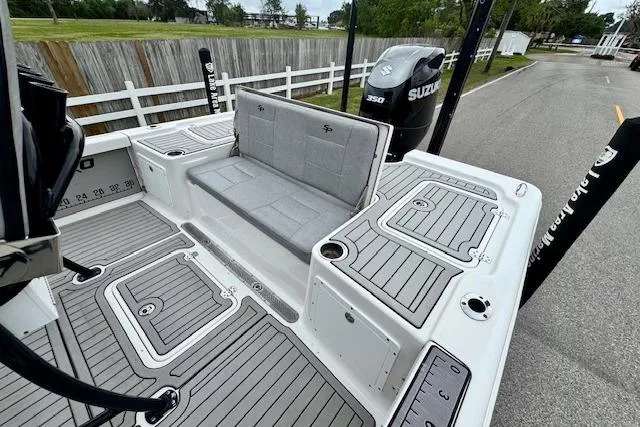 Slide: The Image of 2020 Sea Pro 248 Bay boat with Suzuki 350 engine, featuring spacious seating and deck layout. - 7