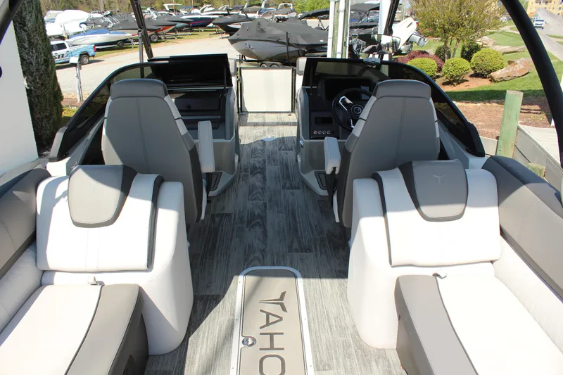 Slide: The Image of 2024 Tahoe Pontoon Cascade Quad Lounge Windshield interior with modern seating and sleek design. - 11