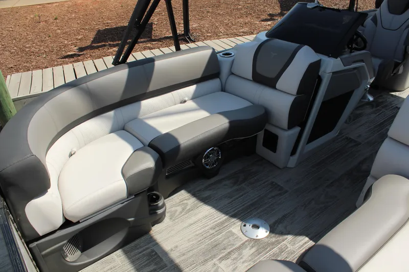 Slide: The Image of 2024 Tahoe Pontoon Cascade Quad Lounge Windshield interior with plush seating and modern design. - 16