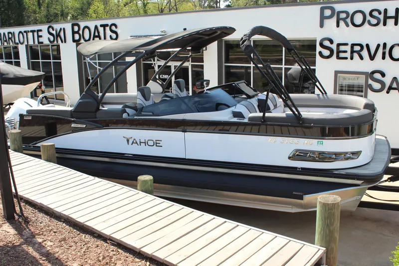 Slide: The Image of 2024 Tahoe Pontoon Cascade Quad Lounge Windshield at Charlotte Ski Boats dealership. - 2