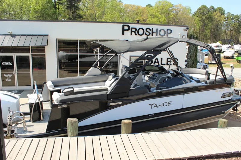 Slide: The Image of 2024 Tahoe Pontoon Cascade Quad Lounge Windshield displayed at a pro shop. - 3