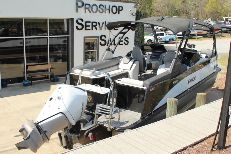Slide: The Image of 2024 Tahoe Pontoon Cascade Quad Lounge Windshield at a dealership, showcasing sleek design and features. - 4