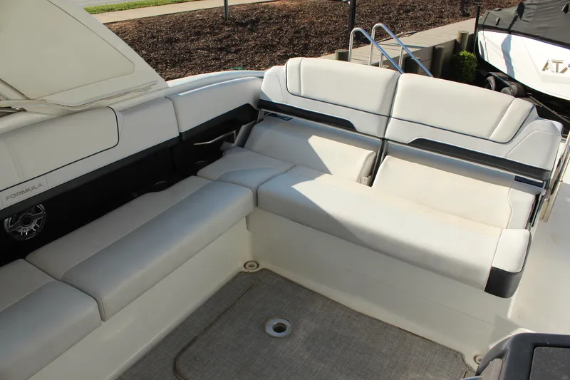 Slide: The Image of 2023 Formula 310 Bowrider I/O boat interior with luxurious seating and modern design. - 10