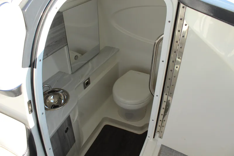 Slide: The Image of 2023 Formula 310 Bowrider I/O boat bathroom interior with sink and toilet. - 15